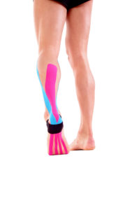 Kinesiology tape on achilles tendon. Physiotherapy for athlete