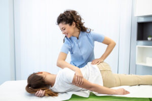 Young woman doctor chiropractor Near Me