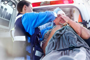 Paramedic Staff taking care of patient injury after car accident