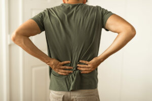 Man suffering from lower back pain.