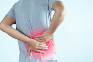 Man suffering from backache and Lower back pain.