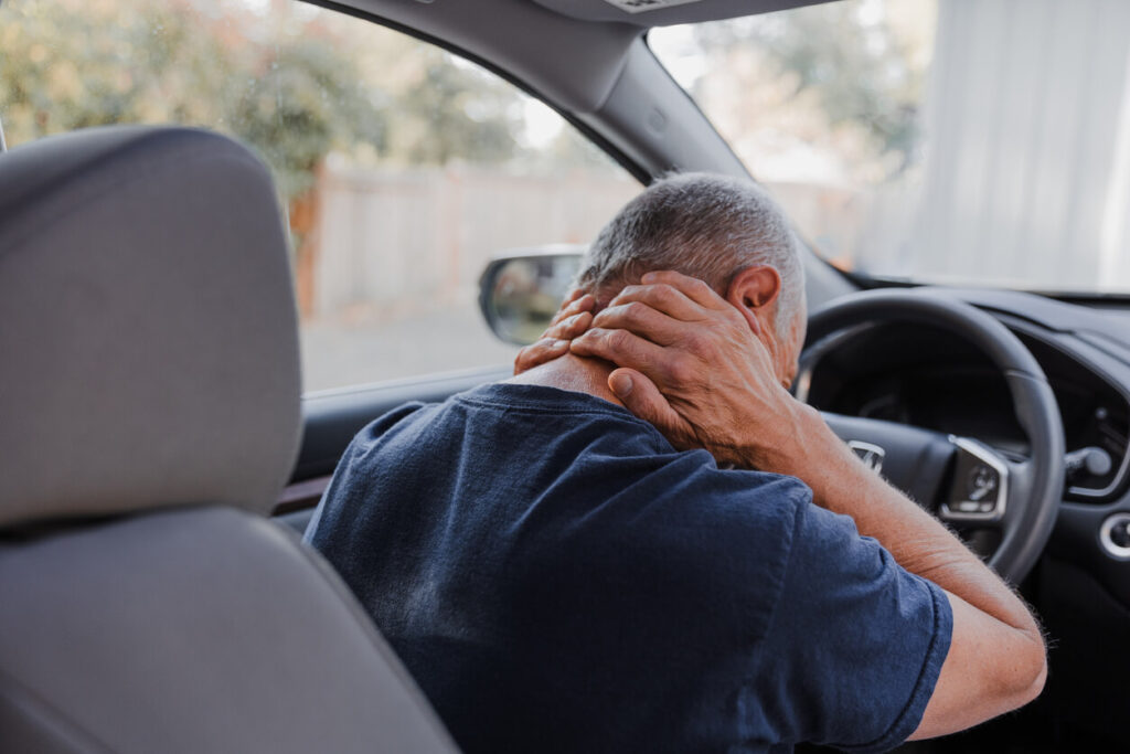 Middle-aged man with neck pain from Whiplash injuries