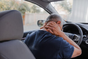 Middle-aged man with neck pain from Whiplash injuries